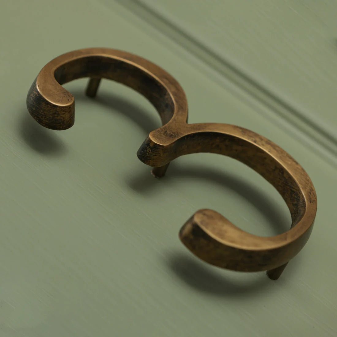 Brass Bee Floating House Number 5 in a heritage finish, featuring a decorative design with rounded edges and a textured surface. The piece is intended for outdoor display and has mounting holes for easy installation.