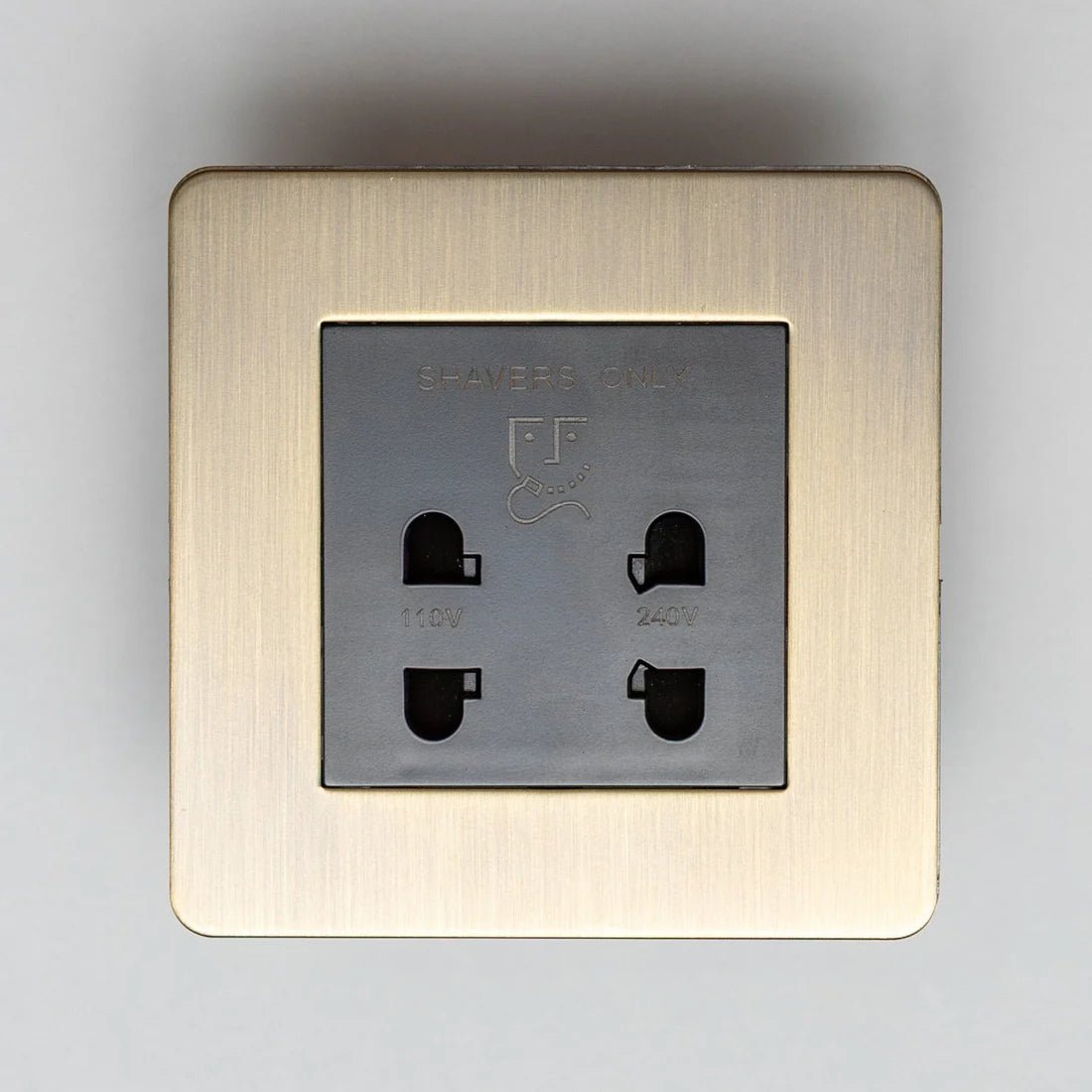 Brass Bee Antique Brass Switches and Sockets featuring a straight knurled design, with a square brass plate and three openings for electrical connection.