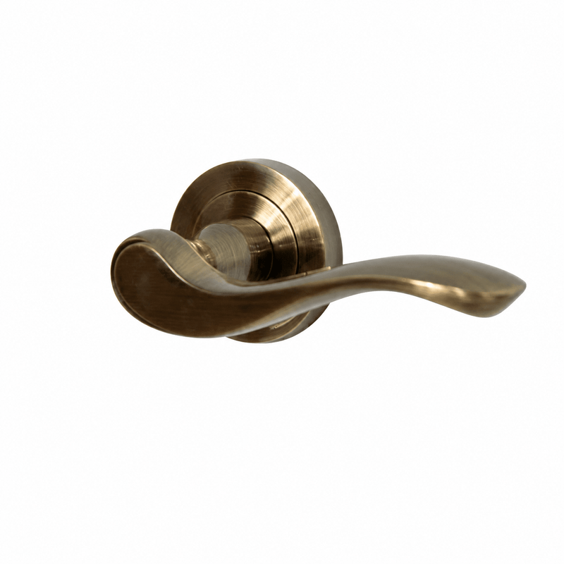 Atlantic Old English Warwick Lever Door Handle on Round Rose in a brushed gold finish, featuring a smooth, curved lever design mounted on a circular rose.