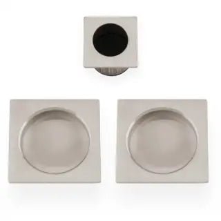 Alexander & Wilks Square Sliding Door Pull Kit featuring two square pull handles with circular recesses and a square central insert, all in a brushed nickel finish.