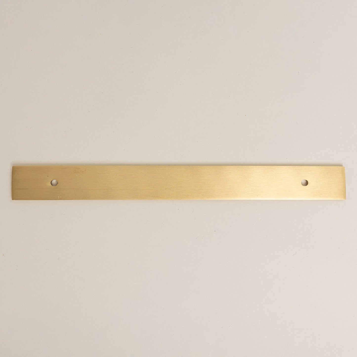 Brass bee Brass Backplate in satin brass finish, featuring a long rectangular shape designed for 128mm/160mm hole-to-hole handles, showing two pre-drilled holes.