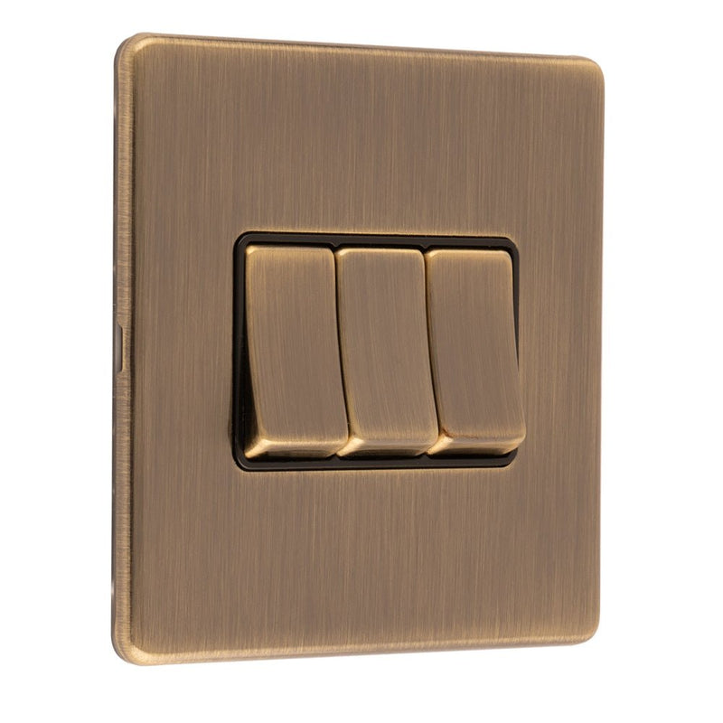 Eurolite Concealed 3mm 3 Gang Switch in antique brass, featuring three toggle switches set within a square plate with a brushed finish.