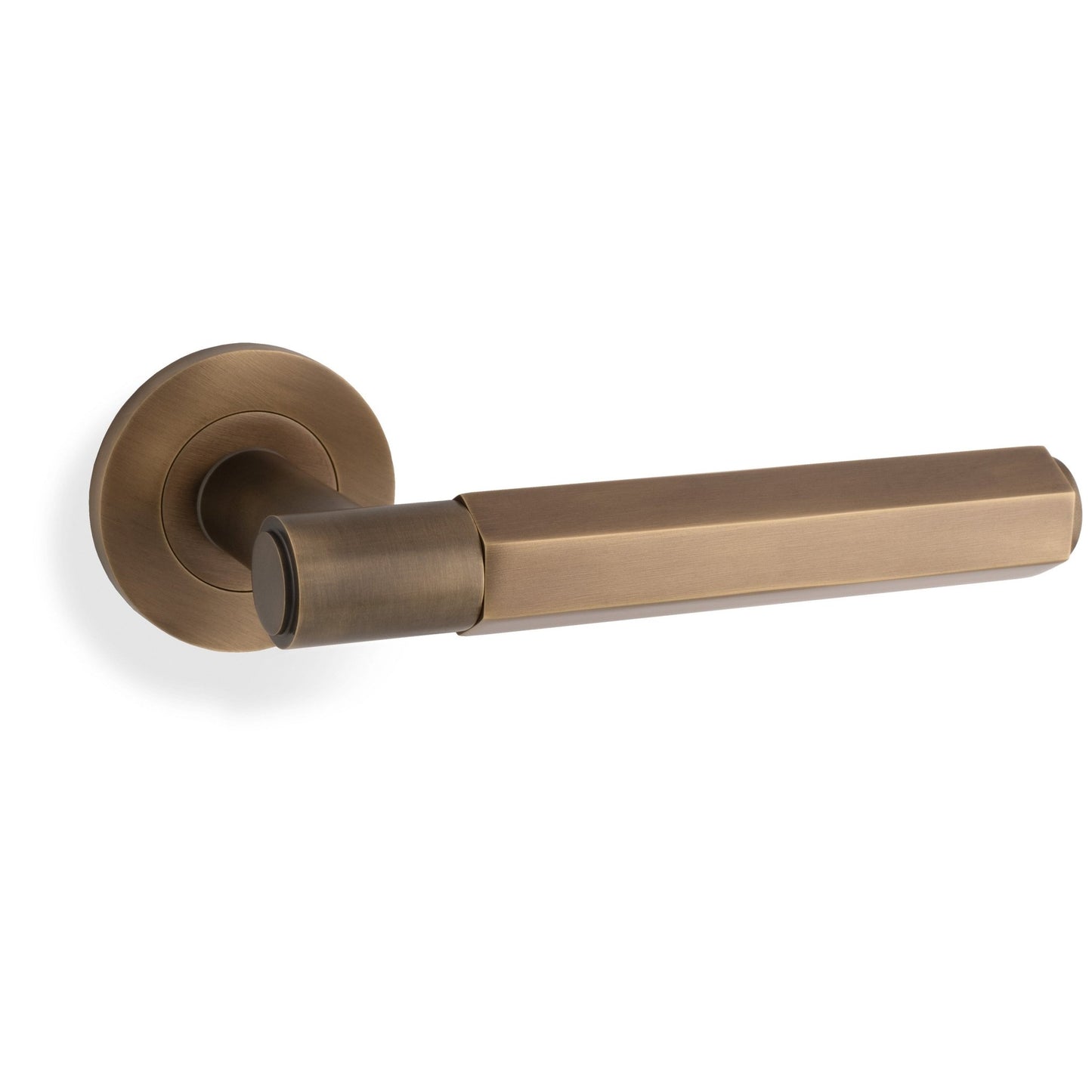 Alexander & Wilks Hex Spitfire Lever on Round Rose in an aged brass finish, featuring a square lever design with a circular rose base.