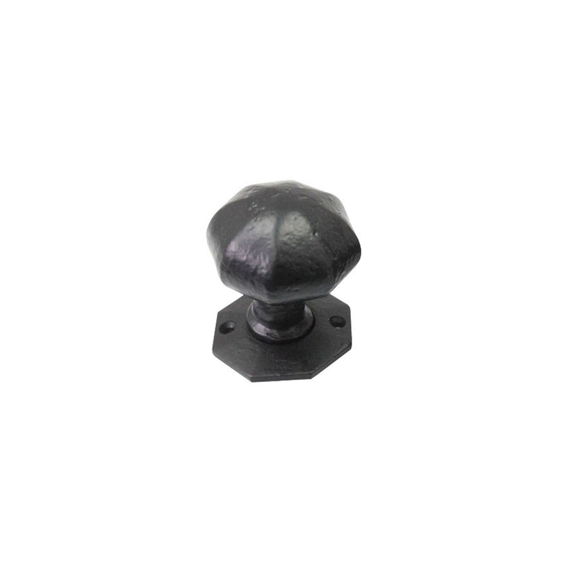 Spira Brass Octagonal Rim/Mortice Door Knob in a dark finish, featuring an octagonal shape with a textured surface and a matching base plate.