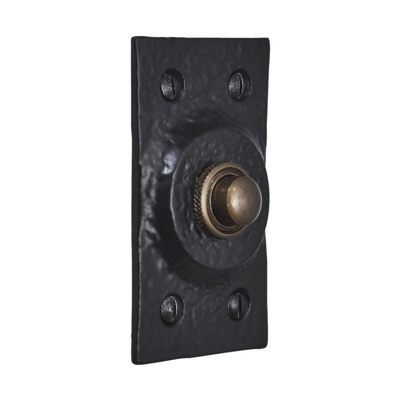 Spira Brass Rectangular Door Bell Push in a black, textured finish with a circular brass button and three visible mounting screws.