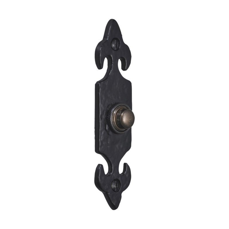 Spira Brass Fleur de Lys Door Bell Push in black finish, featuring a decorative design and a round push button, made of durable metal with a textured surface for added character.