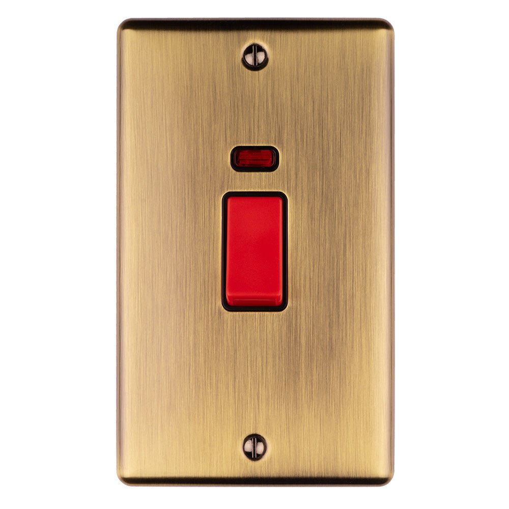 Eurolite Enhance Decorative 45Amp Switch in antique finish featuring a red switch and neon indicator. The switch is mounted on a brushed metal plate with two visible screws.