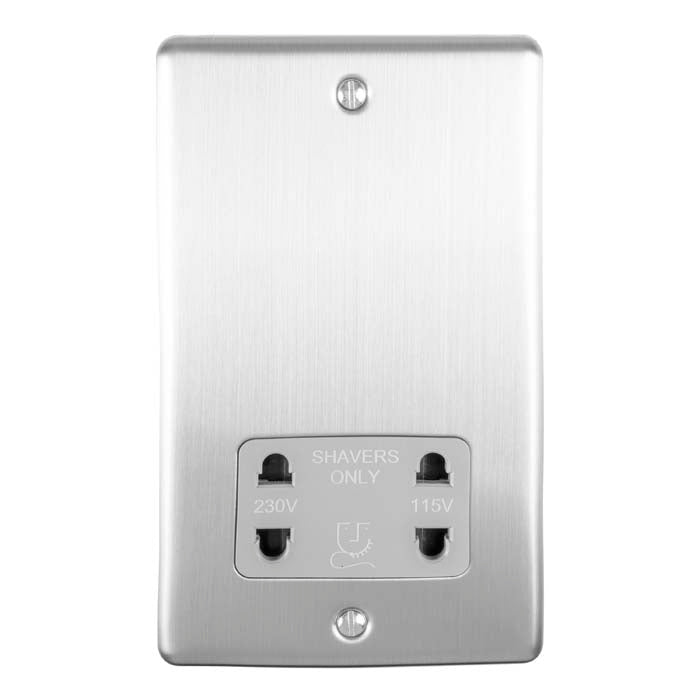 Eurolite Enhance Decorative Shaver Socket in satin stainless finish, featuring two sockets labeled for 230V and 115V use, with a sleek rectangular design and visible mounting screws.