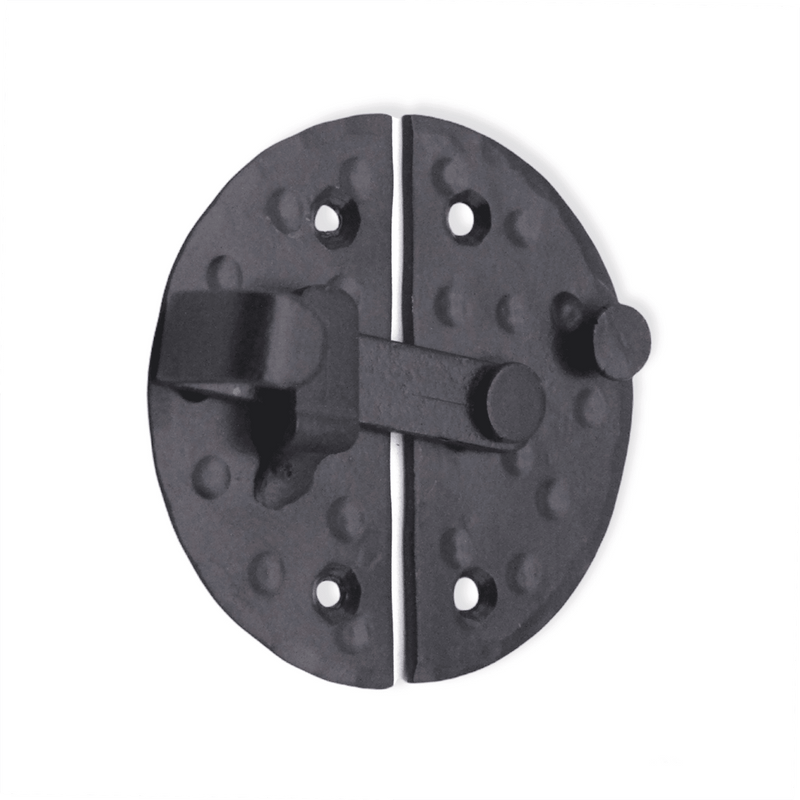 Spira Brass Marvel Cabinet Lock in a black finish, featuring a round shape with a textured surface and two screw holes for installation.