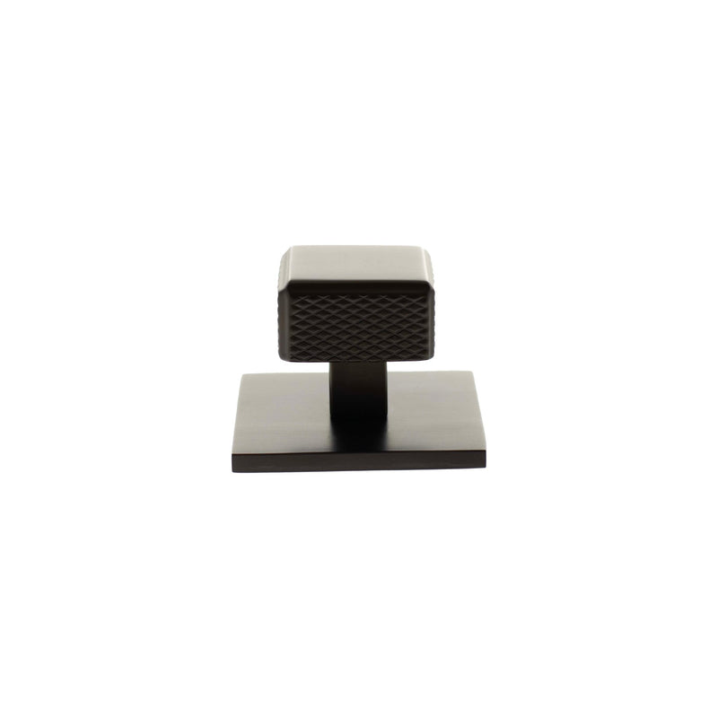 Atlantic Millhouse Brass Eiffel Knurled Square Cabinet Knob Handle on Backplate in dark bronze finish, featuring a textured square knob design mounted on a flat, square backplate.