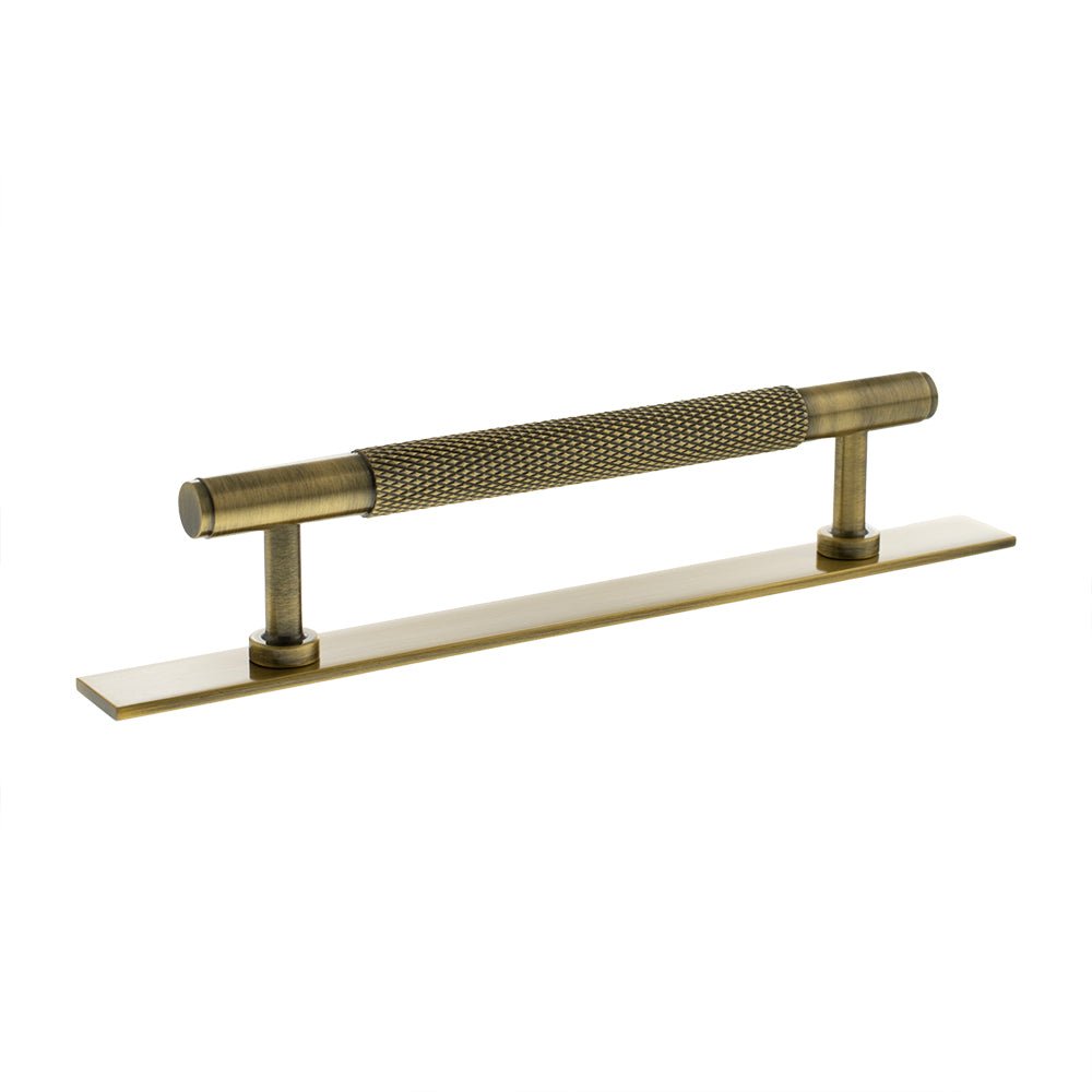 Atlantic Millhouse Brass Eiffel Knurled T-Bar Cabinet Pull Handle on Backplate, measuring 128mm, featuring a textured knurled grip and a sleek backplate in a brushed brass finish.