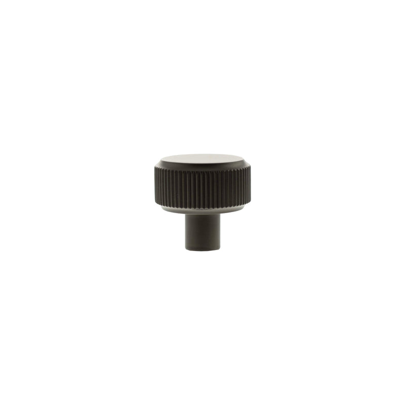 Atlantic Millhouse Brass Battersea Linear Round Cabinet Knob Handle in a bronze finish, featuring a ribbed design on the base and a smooth top surface, designed for furniture and cabinet applications.