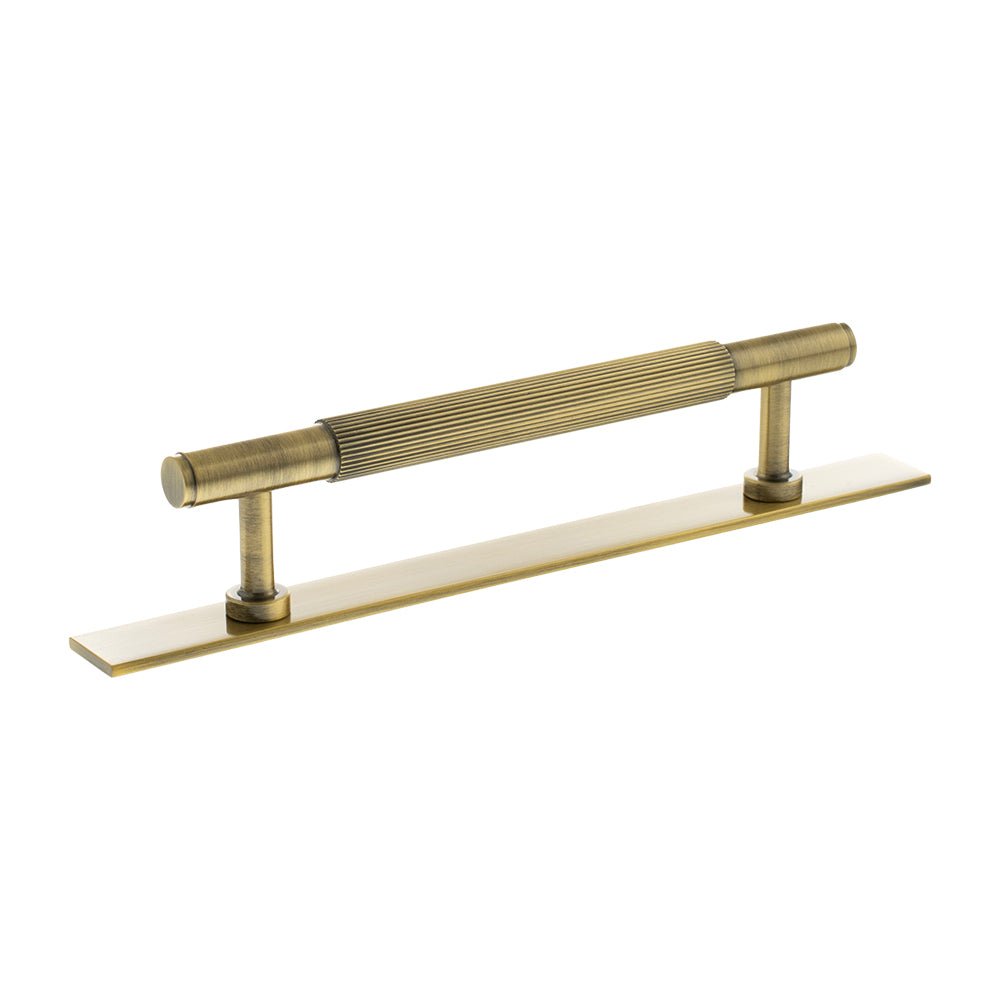 Atlantic Millhouse Brass Battersea Linear T-Bar Cabinet Pull Handle on Backplate, measuring 128mm, featuring a ribbed handle design and a sleek backplate in a brushed brass finish.