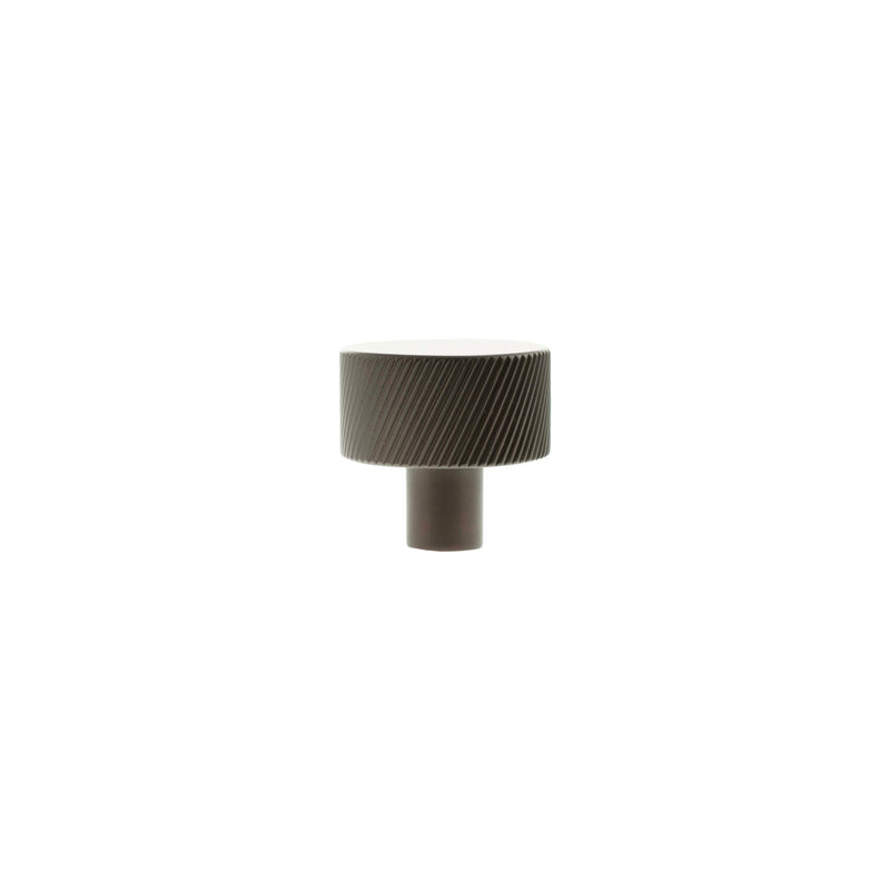Atlantic Millhouse Brass Paddington Spiral Round Cabinet Knob Handle in a brushed brass finish, featuring a spiraled texture on the round top and a cylindrical base.
