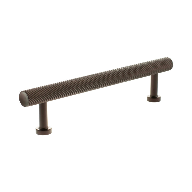 Atlantic Millhouse Brass Paddington Spiral T-Bar Cabinet Pull Handle in dark brass finish, measuring 128mm in length with a ribbed texture on the handle and two mounting posts for installation.