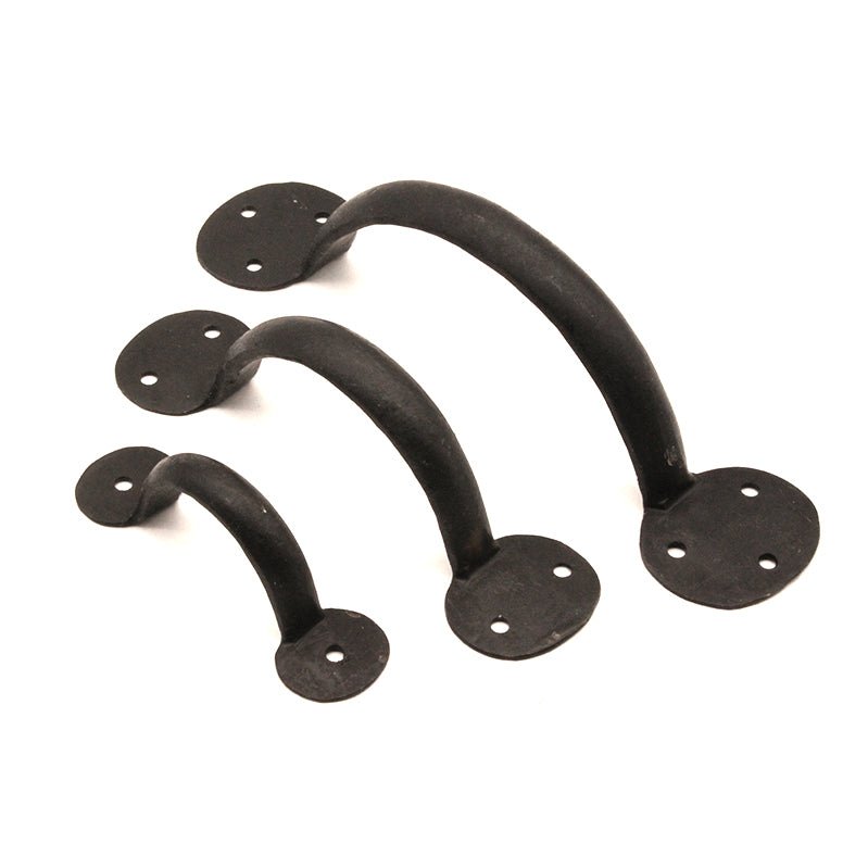 Spira Brass Iron Penny-End Door Handle in beeswax finish, featuring a curved design available in three sizes with circular mounting plates. Made from durable iron, ideal for enhancing door functionality.