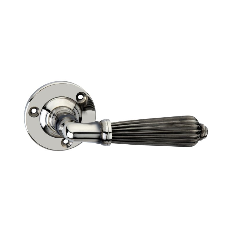 Spira Brass Regency Door Handle with a polished chrome finish and fluted design, featuring a rounded backplate and a decorative grip for easy handling.