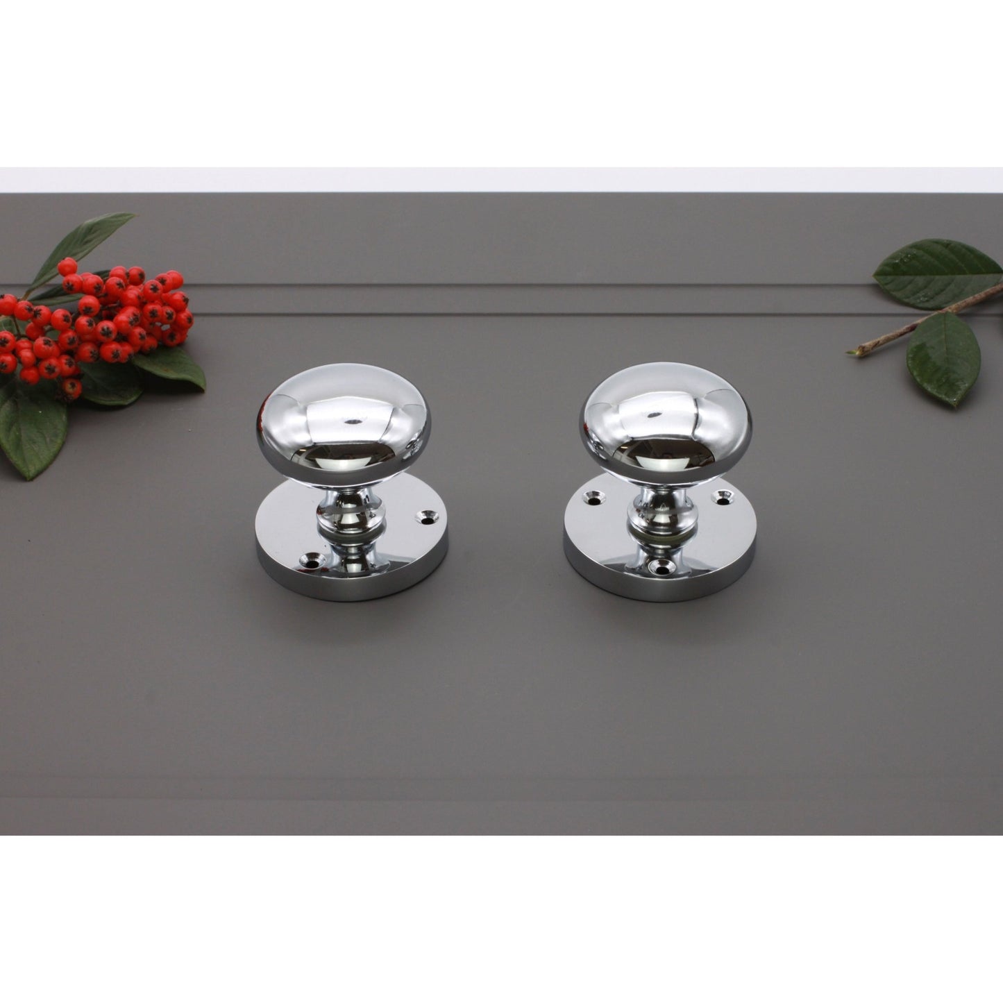 Spira Brass Victorian Door Knob – Mortice in a polished chrome finish, featuring rounded knobs and circular backplates. The set includes two knobs designed for mortice installation.