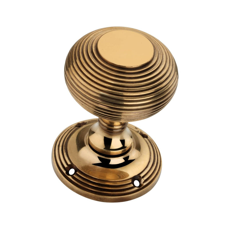 Spira Brass Beehive Door Knob 55mm in polished brass finish, featuring a rounded design with ribbed texture and a circular base for mounting.