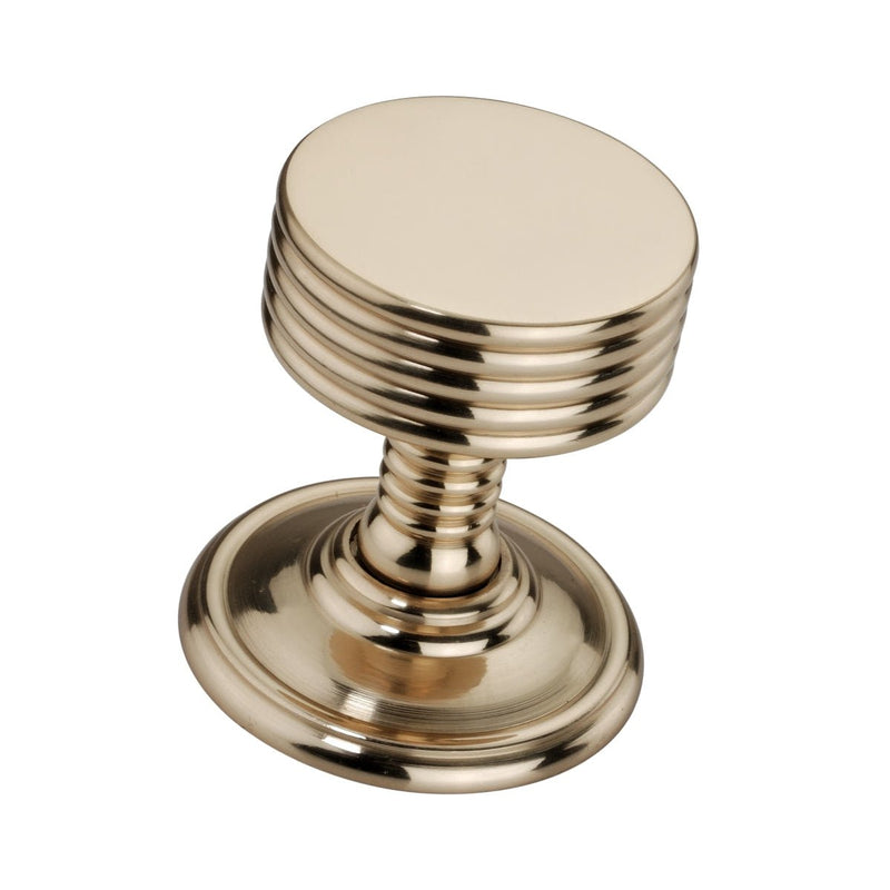 Spira Brass Oxford Mortice Door Knob in polished brass finish, featuring a round knob with vertical grooves and a circular base for installation.