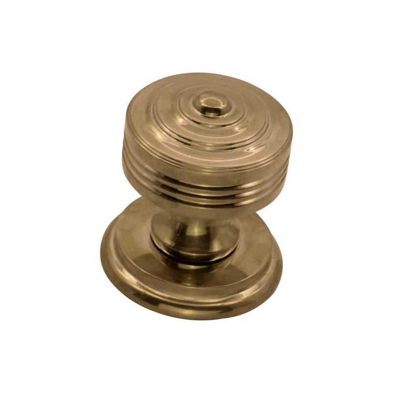 Spira Brass Carter Mortice/Rim Door Knob in a polished brass finish, featuring a rounded top with horizontal grooves and a circular base.