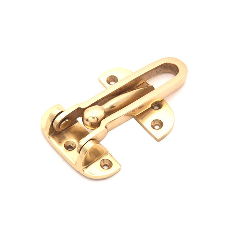 Spira Brass Door Guard 105mm in polished brass, featuring a sturdy locking mechanism and two base plates for secure mounting, designed for enhancing door security.