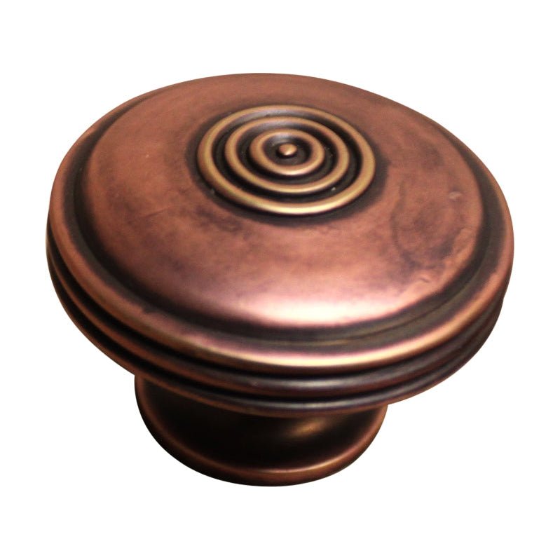 Spira Brass Bloxwich Large 40mm Cupboard Knob in an antique copper finish, featuring a circular design with concentric rings and a smooth rounded base.