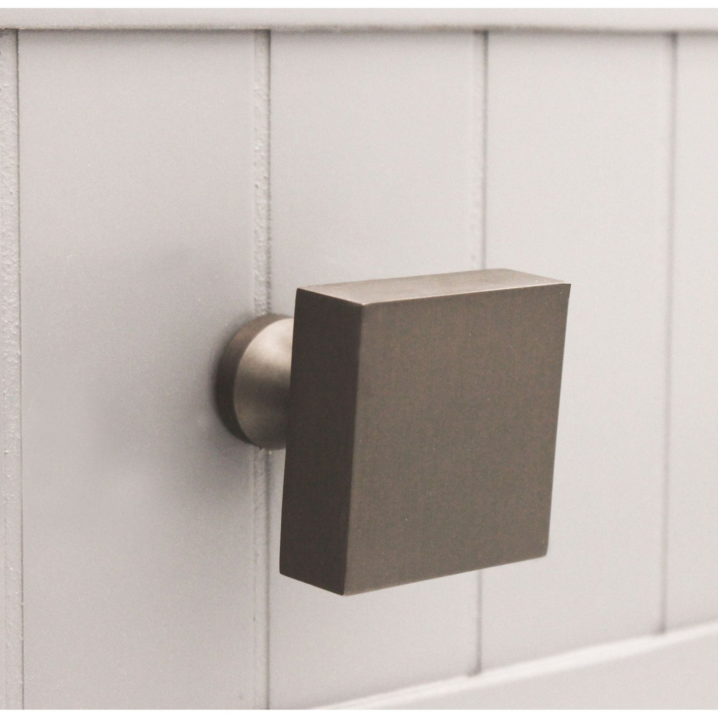Spira Brass Square Cupboard Knob in a square shape with a matte finish, featuring a brushed nickel base, designed for a clean and modern look on cabinetry.