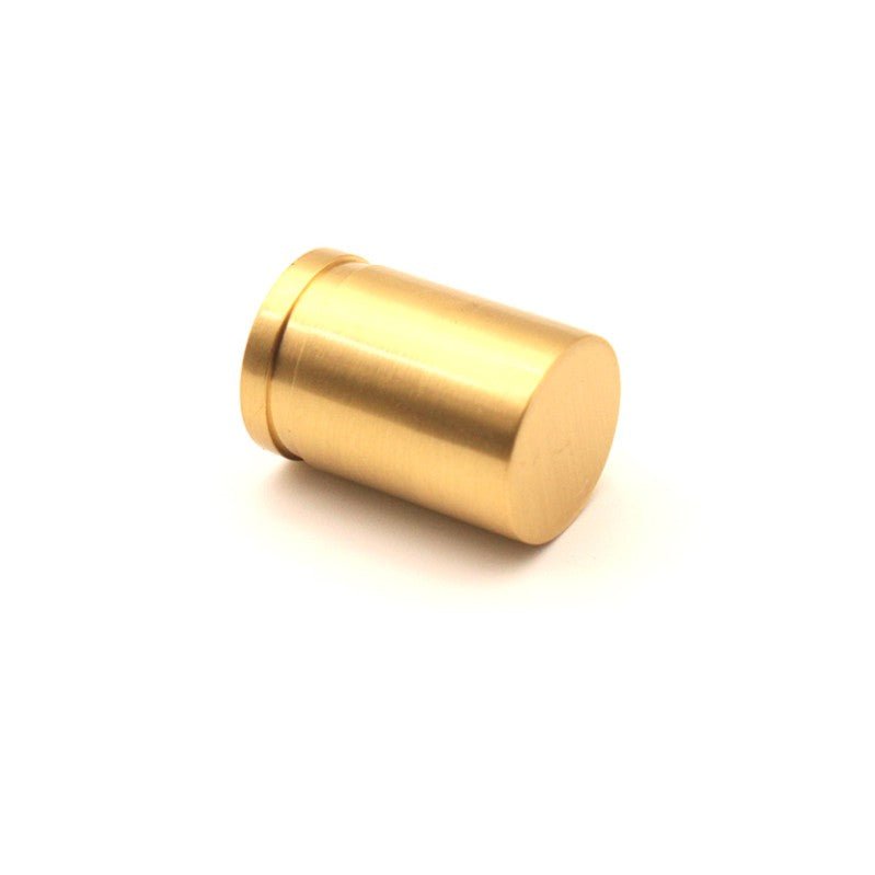 Spira Brass Cylinder Cupboard Pull in polished gold finish, featuring a cylindrical shape and a flat top, made of brass for durable use.