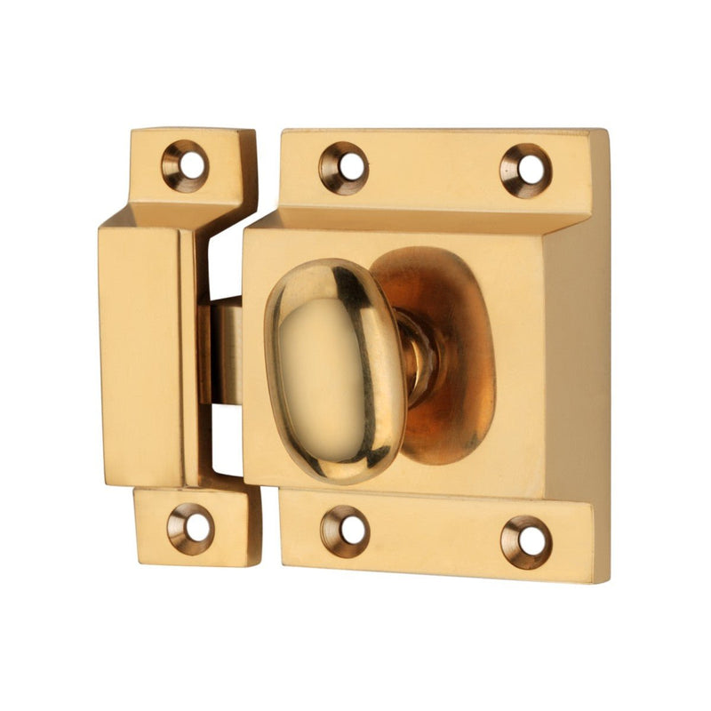 Spira Brass Cupboard Catch in polished brass, featuring a rounded knob and a rectangular base plate with multiple mounting holes for secure installation.