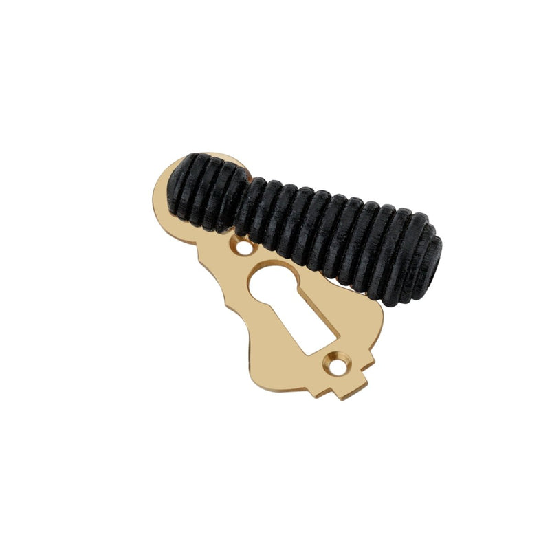 Spira Brass Ebonised Beehive Escutcheon featuring a gold-colored metal base with a ribbed black beehive design on top, designed to cover keyholes with an elegant finish.
