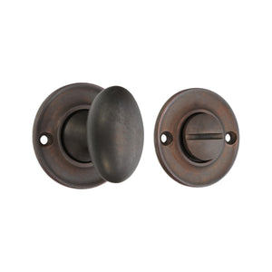 Spira Brass Slimline Turn & Release in oil-rubbed bronze, featuring a rounded knob and a matching round plate for a sleek design. The set includes a turn mechanism for privacy, designed for interior doors.