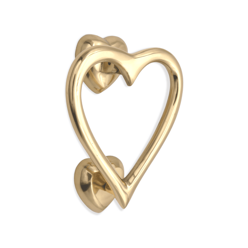 Spira Brass Heart Door Knocker in polished brass finish, featuring a heart-shaped design with a sturdy mounting plate and backplate. The knocker has a smooth surface that highlights its elegant shape.
