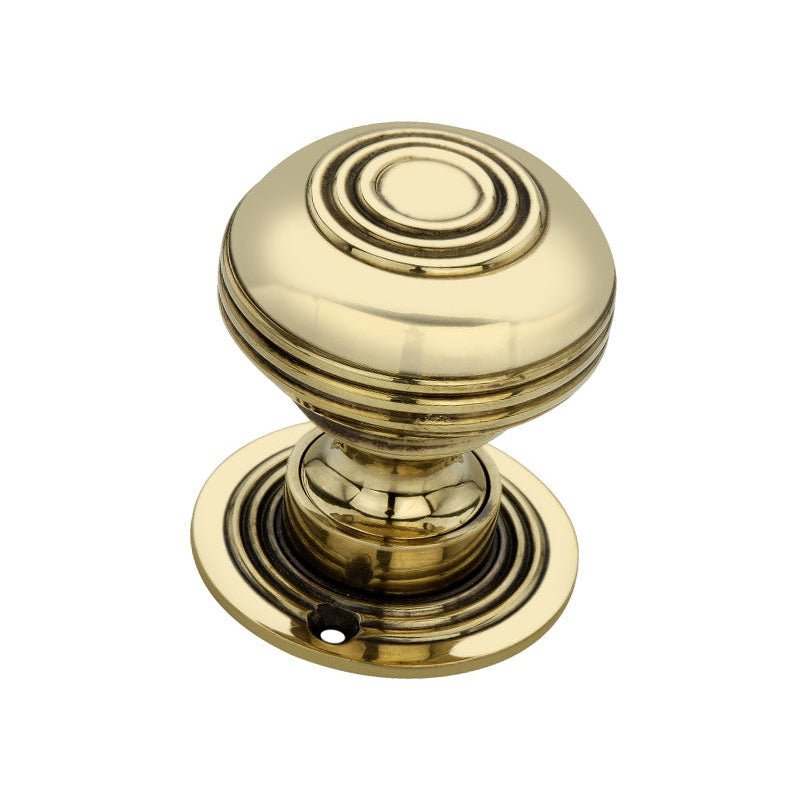 Spira Brass Bloxwich Large 60mm Rim/Mortice Door Knob in polished brass finish, featuring a round knob design with ridged detailing and a circular base plate.