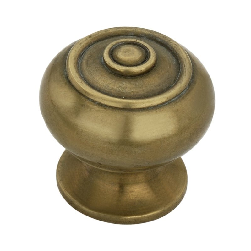 Spira Brass Bloxwich Small cupboard knob in an antique brass finish, featuring a rounded design with a decorative ring detail on top.
