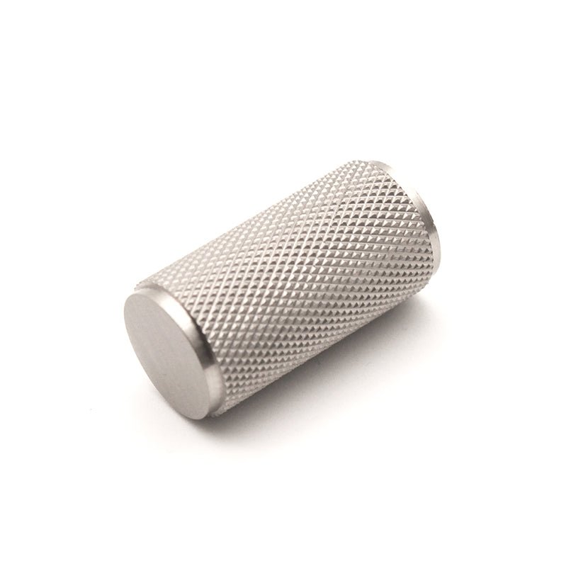 Spira Brass Knurled Cylinder Cupboard Pull in brushed silver finish, featuring a cylindrical shape with textured knurled grip surface for enhanced handling.