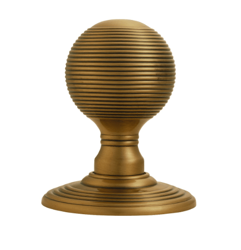 Carlisle Brass Delamain Reeded Knob in a brushed brass finish, featuring a spherical shape with ribbed detailing and a decorative base for a classic look.