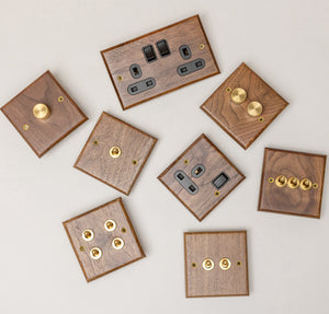 Brass Bee Black Walnut Switch & Socket — 1 Gang 2-Way Toggle (W Series) featuring a variety of designs in black walnut with brass accents. The set includes multiple toggle and socket options for a customizable look.