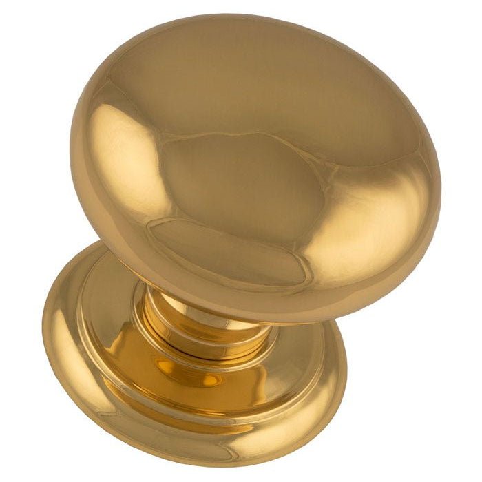 Carlisle Brass Large Centre Door Knob in polished brass finish, featuring a smooth, rounded shape and a decorative base for secure attachment.