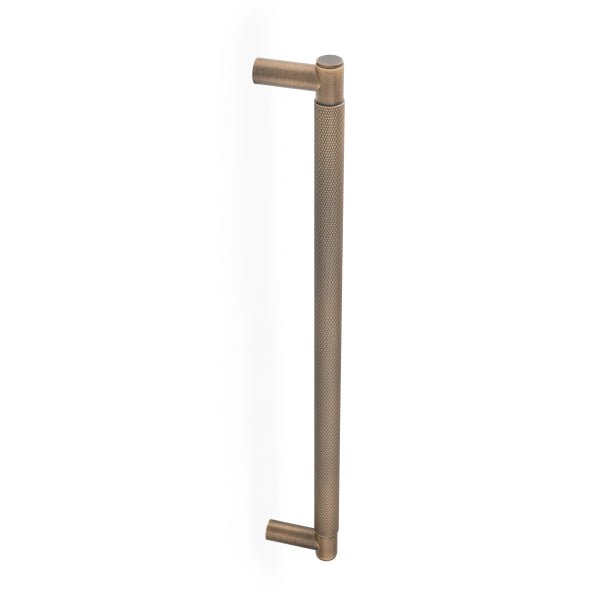 Alexander & Wilks Spitfire Diamond Knurled Pull Handle in a bronze finish, featuring a textured diamond pattern along the shaft and cylindrical ends for grip.
