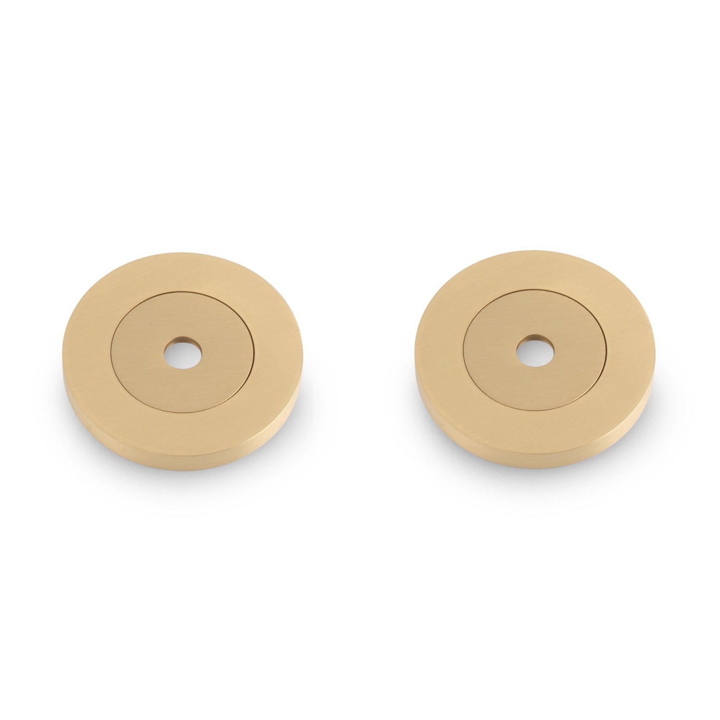 Carlisle Brass Rose Packs to Suit Pull Handles - Pair in a brass finish, featuring round discs with a centered hole, designed to complement various pull handle styles.