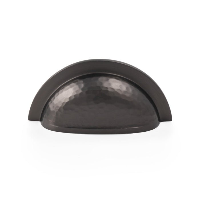 Alexander & Wilks Bardom Hammered Ridged Cup Pull in a dark metallic finish, showcasing a rounded shape with a textured surface, designed for cabinet or drawer installation.