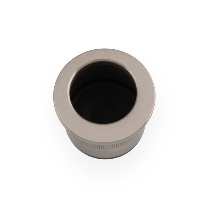 Alexander & Wilks Round Sliding Door Finger Edge Pull in brushed nickel finish with a circular design and a black interior, designed for sliding doors.