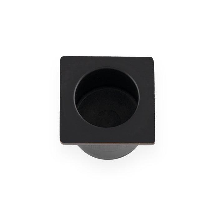 Alexander & Wilks Sliding Door Finger Edge Pull (Square) in a matte black finish, featuring a square design with a circular recess for easy grip. Made of durable metal for long-lasting use.