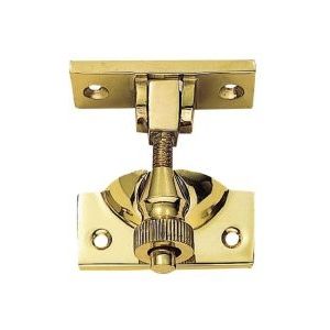 Carlisle Brass Brighton Pattern Sash Fastener in polished brass, featuring a decorative design with a central knob and two mounting plates for installation.