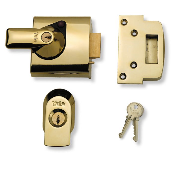 Carlisle Brass British Standard Nightlatch in polished brass finish, featuring a slide bolt mechanism, a key cylinder with two keys, and a rectangular strike plate.