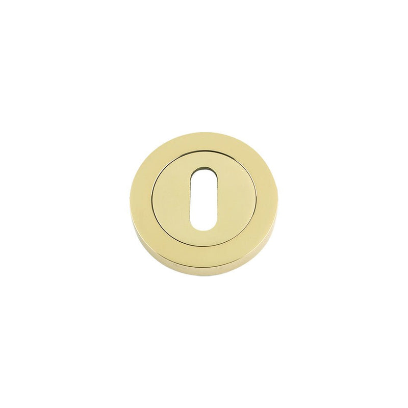 Zoo Hardware Standard Key Profile 50 x 8mm in a polished brass finish, featuring a circular design and a keyhole slot in the center for compatibility with standard key systems.