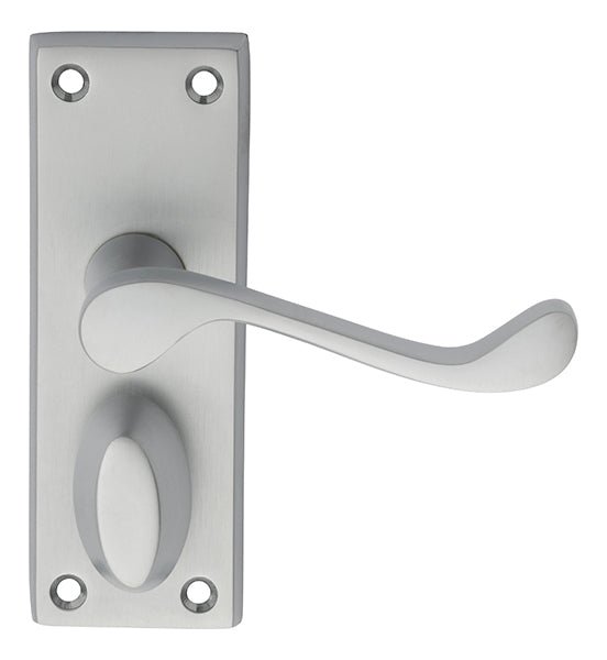 Carlisle Brass Victorian Scroll Lever on Backplate in brushed stainless steel finish, featuring a curved lever handle and an oval rose, with visible mounting holes for easy installation.