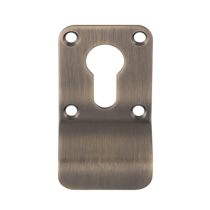 Carlisle Brass Cylinder Pulls in an antique brass finish featuring a keyhole opening and two screw holes for installation.