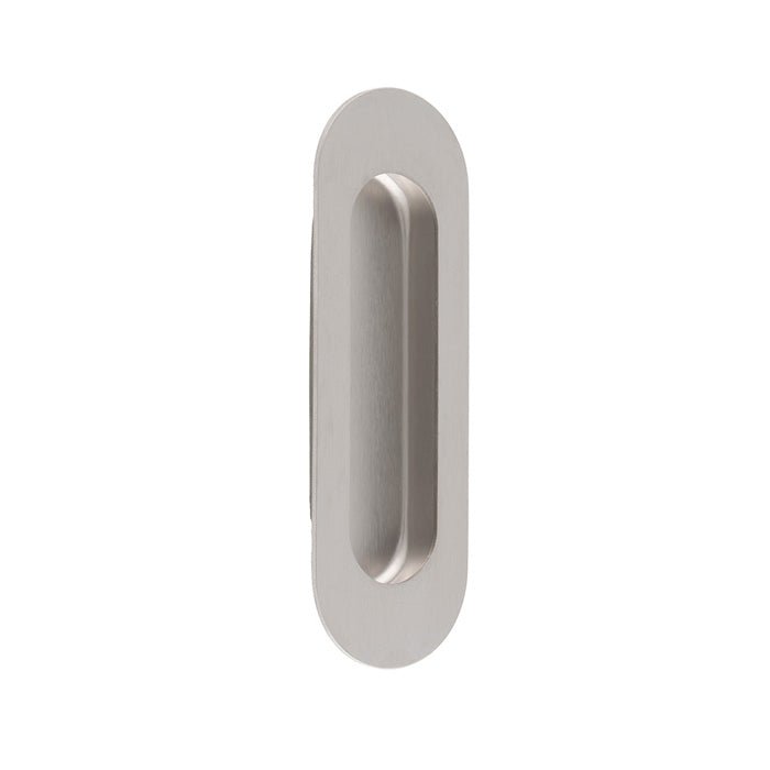 Carlisle Brass Radius Flush Pulls in a brushed nickel finish, featuring an elongated, oval shape designed for flush installation. The pull has a smooth surface and a recessed grip area.
